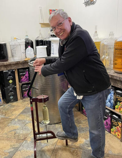 Bill, our favorite volunteer, helping to bottle wine
